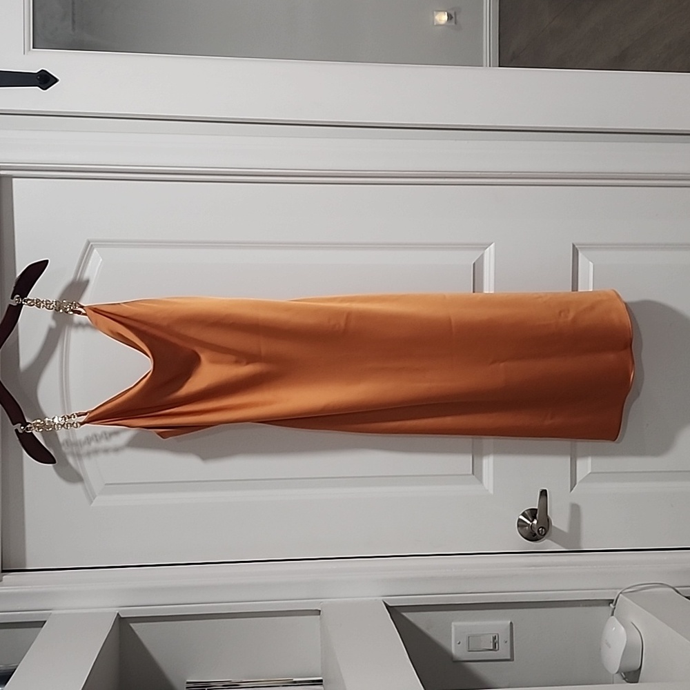 Beautiful satin dress With gold straps.